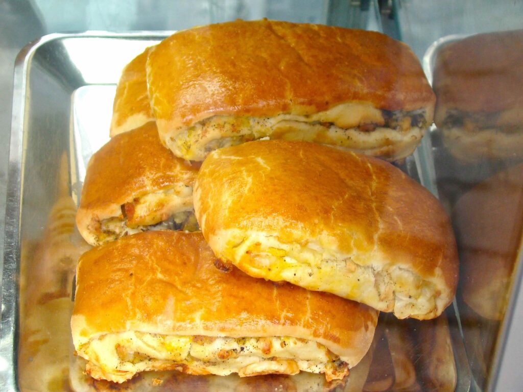 panini napoletani, rustici salati tipici di Napoli, ripieni con salame, provola e uova sode